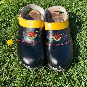 1970S BLACK RED AND YELLOW LEATHER SWEDISH WOODEN CLOGS WITH FLORAL EMBROIDERY